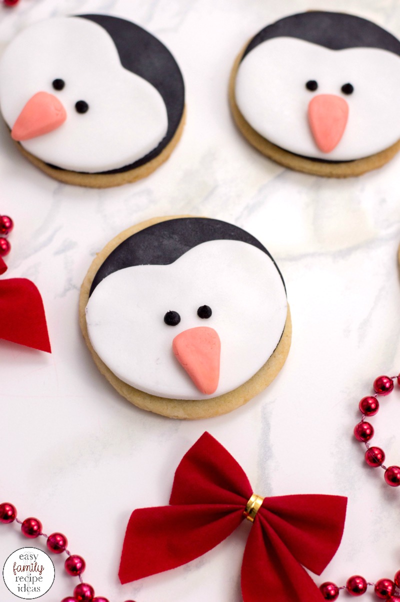 These adorable Penguin Cookies are the perfect treat for your next winter theme, holiday party or get-together. These cookies are super easy to make, and they taste delicious. Penguin Cookies Decorating, How to Make Penguin Cookies. So whether you serve these up on your holiday cookie tray, for a themed birthday party, or just for fun, everyone will want a cute penguin cookie. 