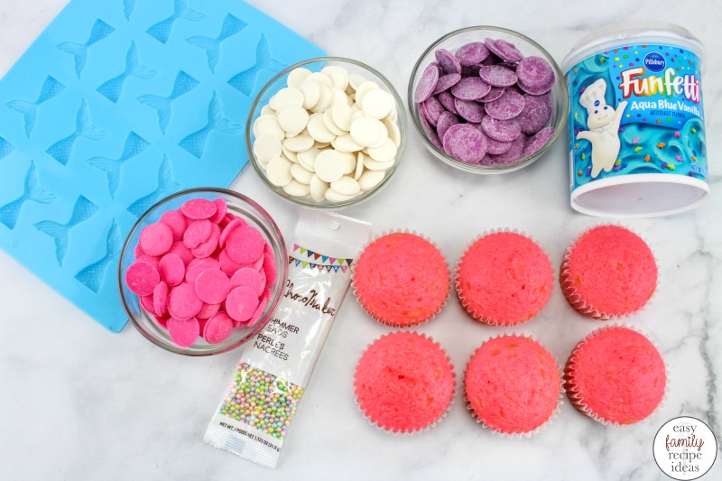 These Mermaid Cupcakes are a perfect sweet summer treat, They are easy to make and look amazing for a Summer Party. Serve EASY Mermaid cupcakes for an ocean theme party, Under the Sea Theme or fur the cutest Mermaid Tail Cupcakes Ever!  