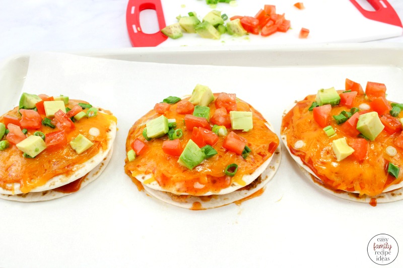 Taco Pizza Recipe, Mexican Pizza Stacks, Stacked Tortilla Taco Pizzas are baked in the oven covered with lots of delicious melted cheese and they taste amazing. Serve this yummy taco pizza with your favorite Taco Stuffings for a delicious Mexican pizza. 