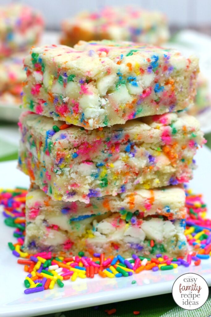 These Funfetti Cookie Bars are scrumptious. Load them up with rainbow sprinkles for a sweet tasty treat. Plus, Funfetti cake mix recipes are the perfect birthday party dessert. Pillsbury Funfetti Cookies and Cake Mix Cookies for your next party food.  