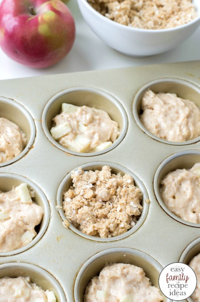 These Apple Muffins are the perfect way to start the day. Not only are they sweet and delicious, but they are the best fall breakfast idea. Get ready to see how easy it is to Make Apple Muffins with Crumble Topping that you'll want to snack on all day. Homemade Apple Muffins for the Win! 
