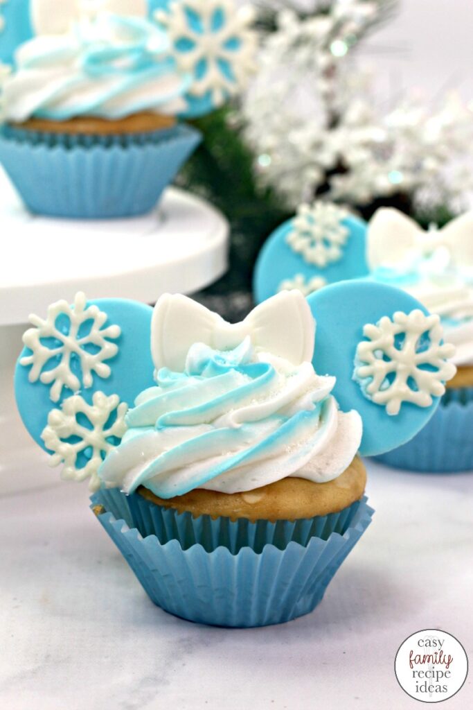 You're going to really love the look and taste of these Disney Frozen Cupcakes. They are so much fun to create and a tasty treat to eat! Frozen Themed Cupcakes starts with an easy boxed cake mix recipe. Frozen Cupcakes are great for a movie night snack or Frozen Themed Birthday party food.  Frozen Disney Cupcakes