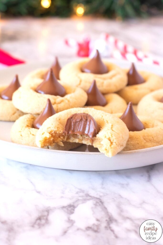 These Thumbprint Hershey Kiss Cookies are a must for the holiday season. The combination of peanut butter and chocolate is amazing! Plus everyone will love these Elf Poop Cookies for a sweet Christmas Cookie idea, Hershey kiss cookies, Peanut Butter Blossom Cookies are Delicious Any time during the year so add this easy peanut butter kiss cookies recipe to your list. 