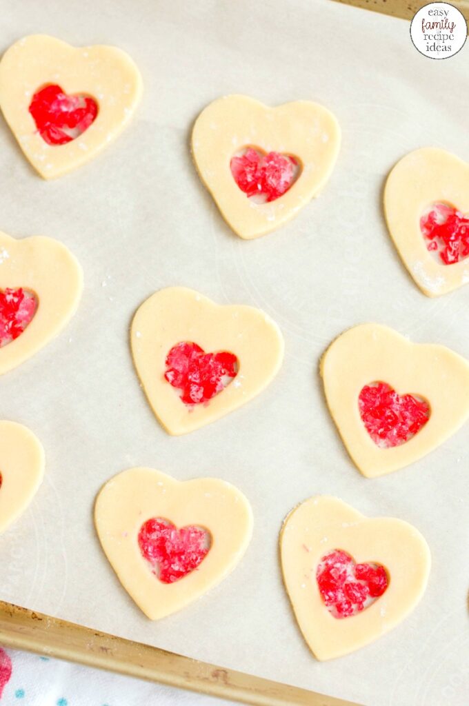 These Stained Glass Valentine Cookies are a tasty treat for Valentine's Day. Heart Cookies are such a fun and easy cookie recipe to make and share!  A handful of simple ingredients will get you the perfect Valentine's Day cookies that are tasty and beautiful. 