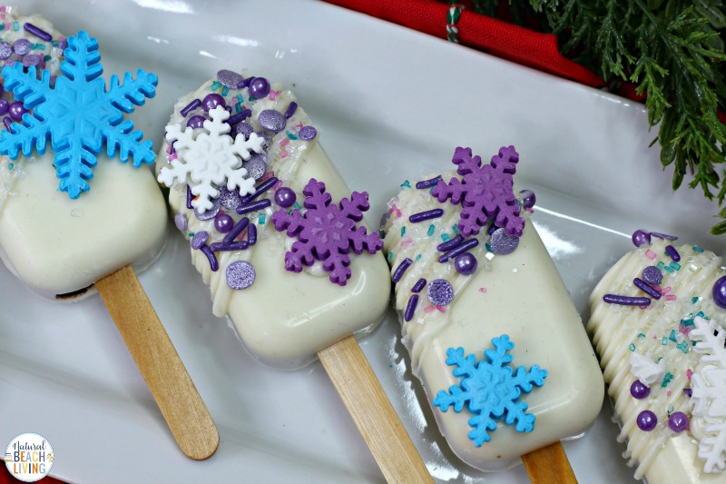 Make The Best Frozen Cakesicles for a Frozen Themed Birthday Party or a Winter Treat for Kids, These decorated Frozen Themed Cakesicles and Frozen Cake Pops are delicious Cakesicles ideas made with boxed cake mix and snowflake sprinkles. 