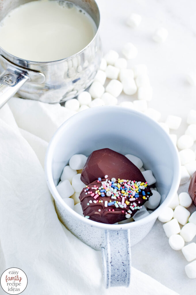 Learn how the make Valentine's Day hot chocolate bombs for enjoying and gifting this Valentine's Day! This hot chocolate bomb recipe is created with heart-shaped chocolate filled with hot cocoa powder and miniature marshmallows. These Heart hot cocoa bombs taste amazing