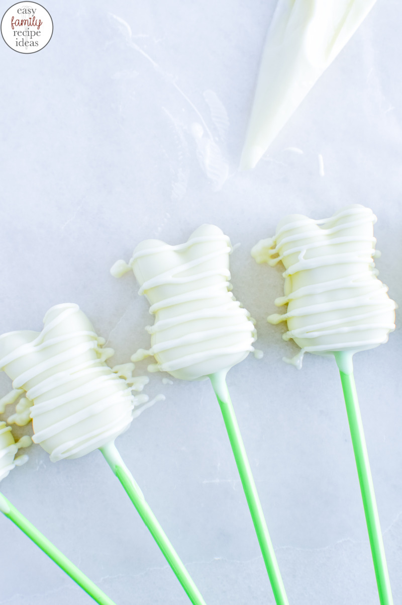  This Vegan Easter Bunny White Chocolate Cheesecake Pops Recipe is The Best! They’ll make a gorgeous addition to your Easter baskets or for a Spring Treat. Easter bunny cheesecake on a stick makes a fun kid-friendly dessert. Plus, they’re delicious!  White chocolate cheesecake Easter bunnies and Homemade Easter Bunny Lollipops for a healthy sweet treat.