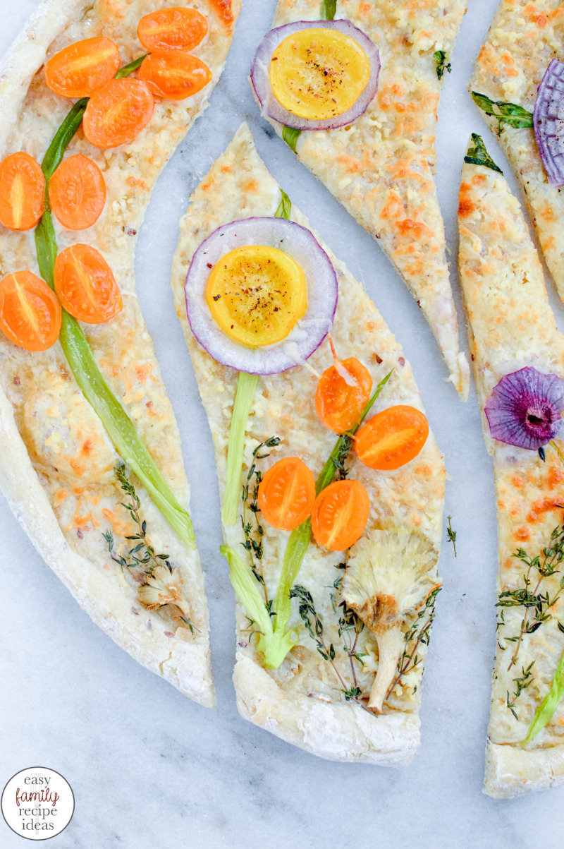 You’ll love enjoying this Spring Vegetable Garden Pizza with your friends and family. It’s not just dinner, it’s a healthy brunch, delicious and easy lunch, and tasty art on a plate. Spring Vegetable Pizza