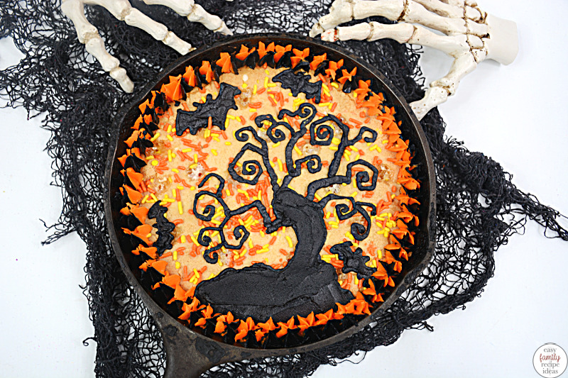 This Halloween cookie cake recipe is a delicious addition to your Halloween Party! If you’re searching for easy Halloween treats for kids, you’re going to love this cookie recipe! It’s a Haunted Tree giant cookie that’s easy to make and perfect for celebrating the fall season 