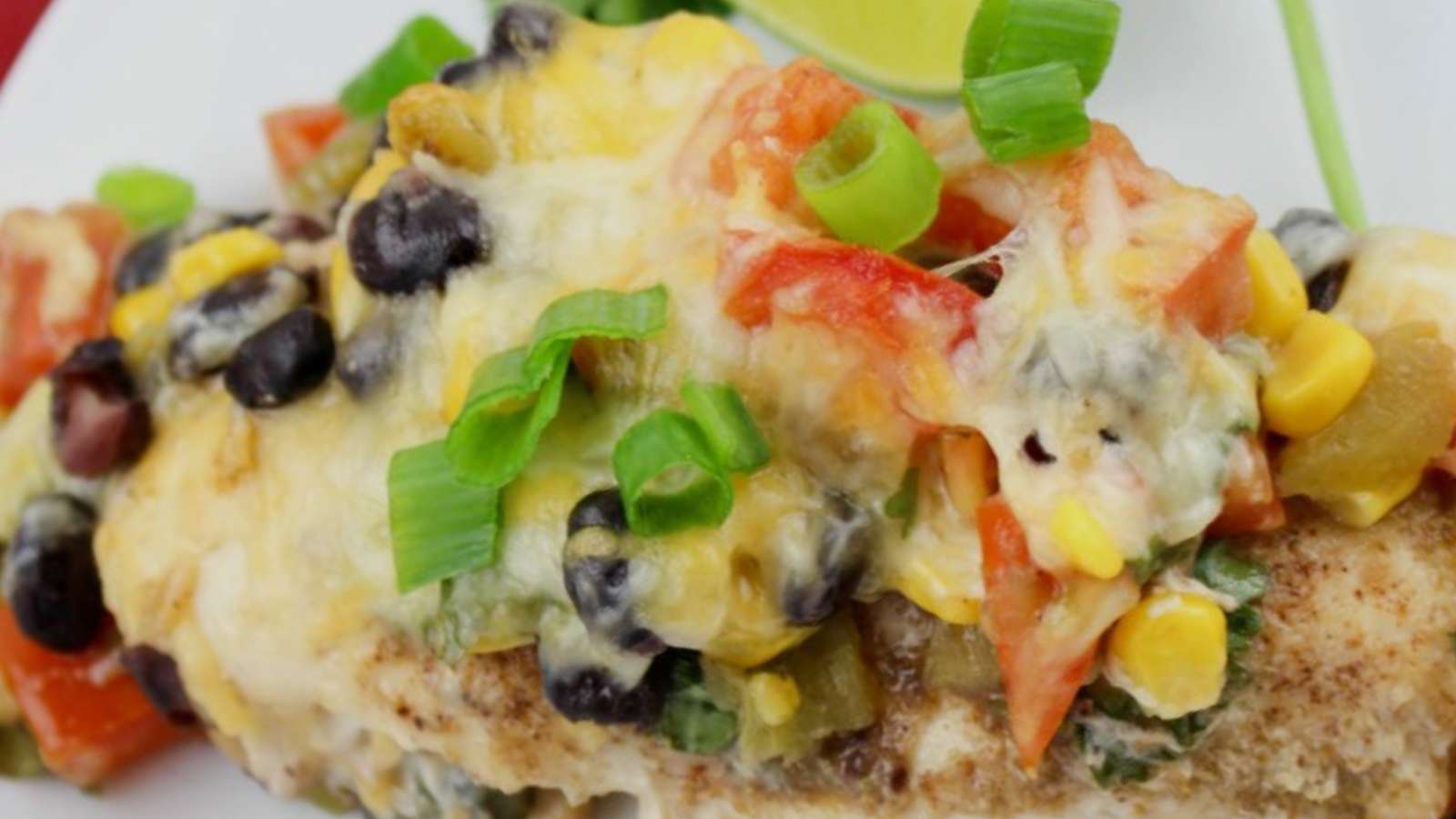 Southwest chicken enchiladas with black beans and tomatoes.