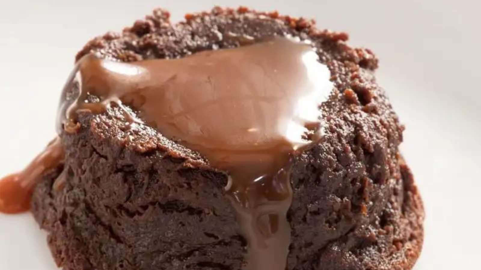 A decadent chocolate pudding drizzled with rich chocolate sauce.